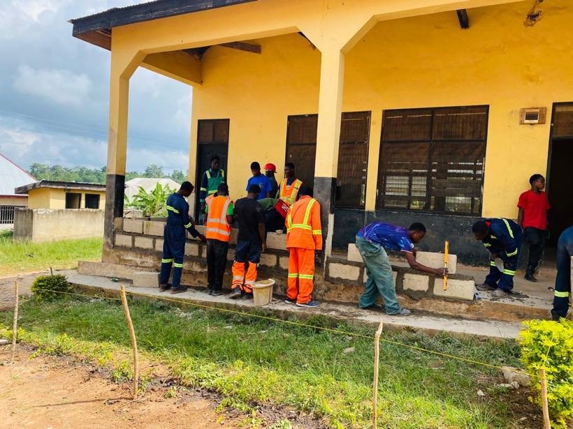 Students working outside one of the centre blocks