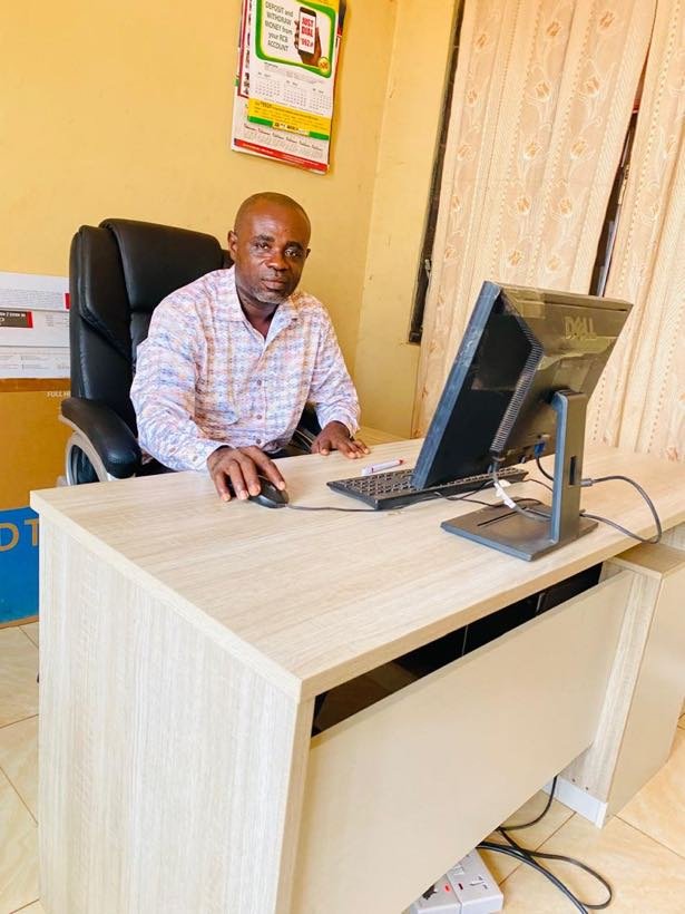 Gyamena Frederick Amoako, Principal, at his desk