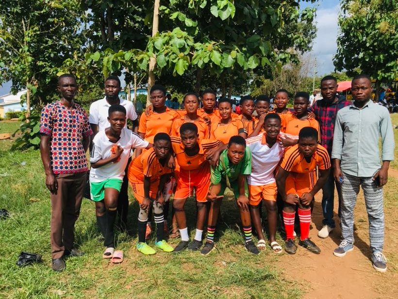 The school football team with their coaches