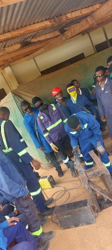 Students watching a welding practical in the workshop