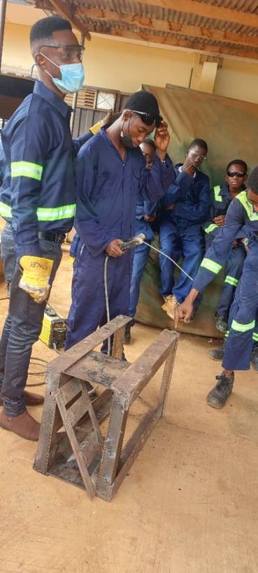 Students gathered in the fabrication workshop
